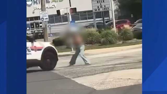 Video: Police cruiser hits woman armed with gun in middle of road - Vimarsana News