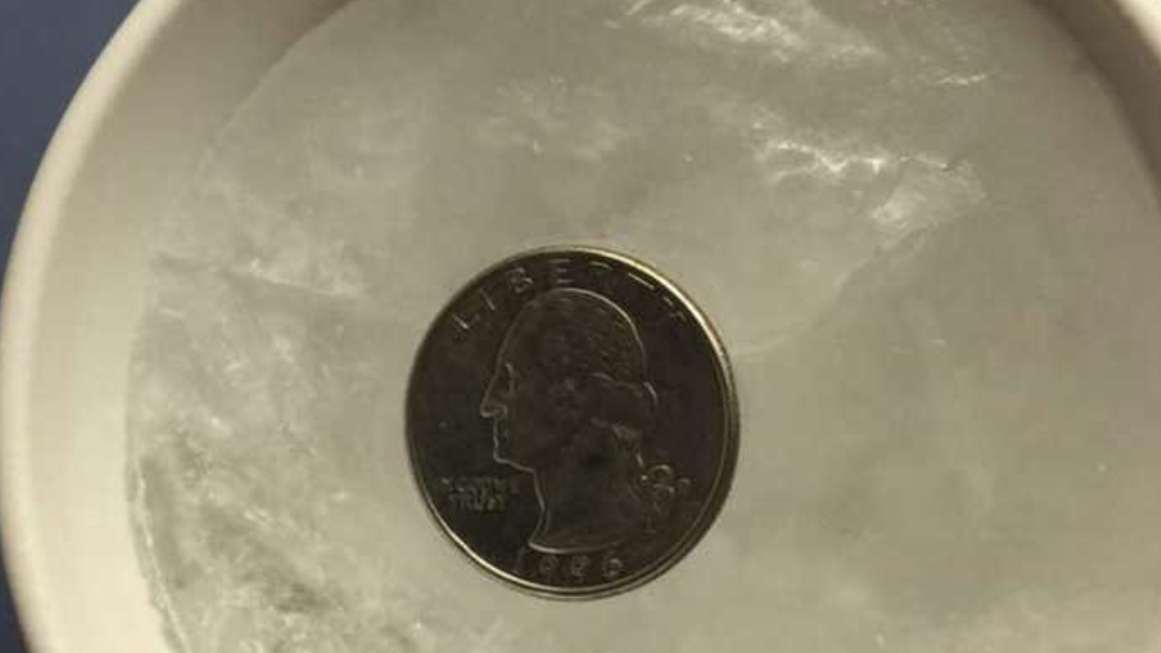 Why you should always put a quarter on a frozen cup of water before storms