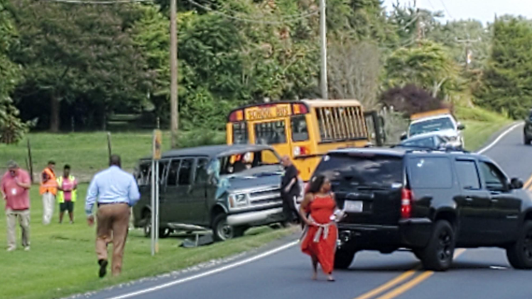 4 injured after triad crash between bus and van