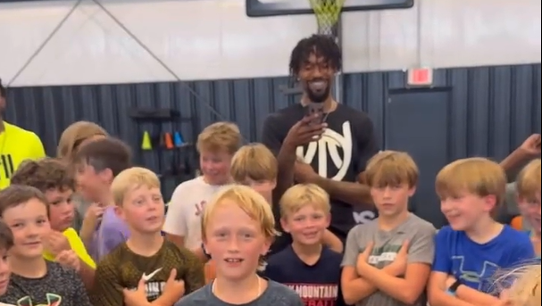 Singing junior basketball player surprises coach and teammates