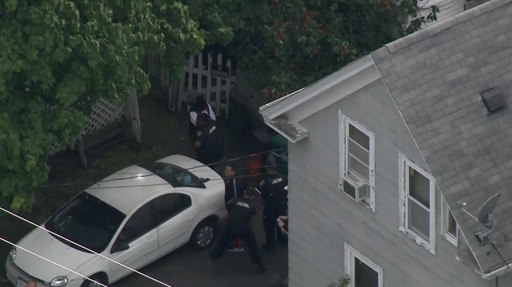 2 men placed in police custody after armed standoff near home in Mass. city
