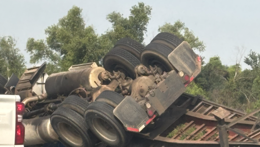Heavy delays due to overturned truck on I-10 west