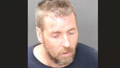 Man charged with assaulting officers, property damage