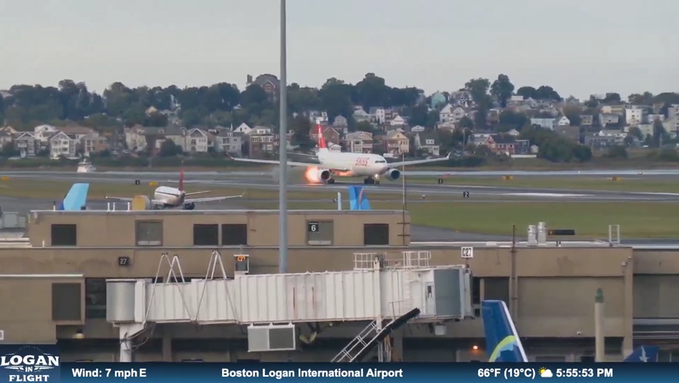 Flames shoot out of Swiss Airlines plane while on runway at Massachusetts airport