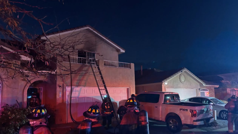 Firefighters rescue 3 from balcony of 2-story house