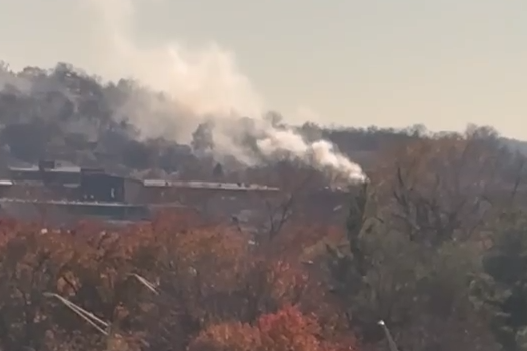 Crews battle large house fire in Newport; smoke plume visible from ...