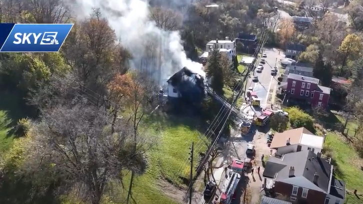 Crews battle large house fire in Newport; smoke plume visible from ...