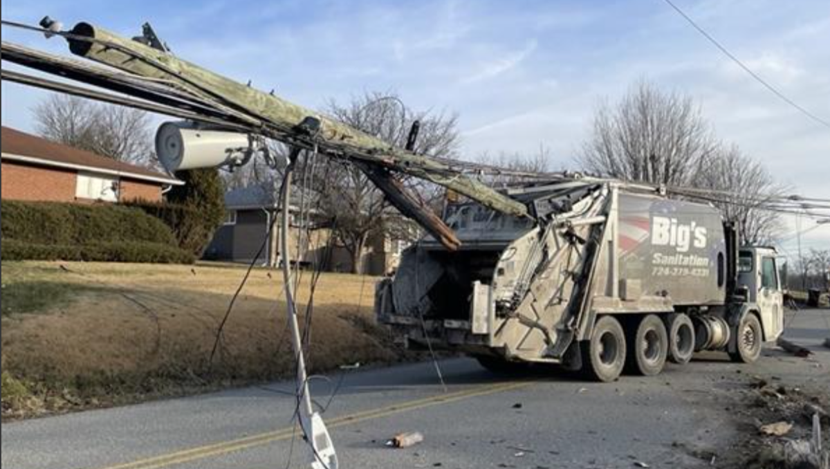 Garbage trucks takes out utility pole, brings down wires in Washington