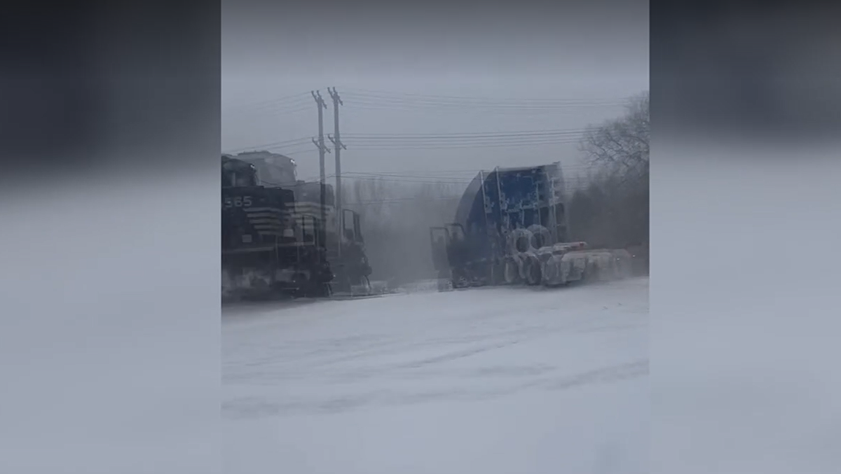 Frightening video shows truck driver escape cab before it's smashed by train in North Carolina
