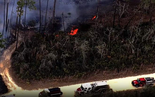 PHOTOS: Firefighters work to contain brush fire in Marion County