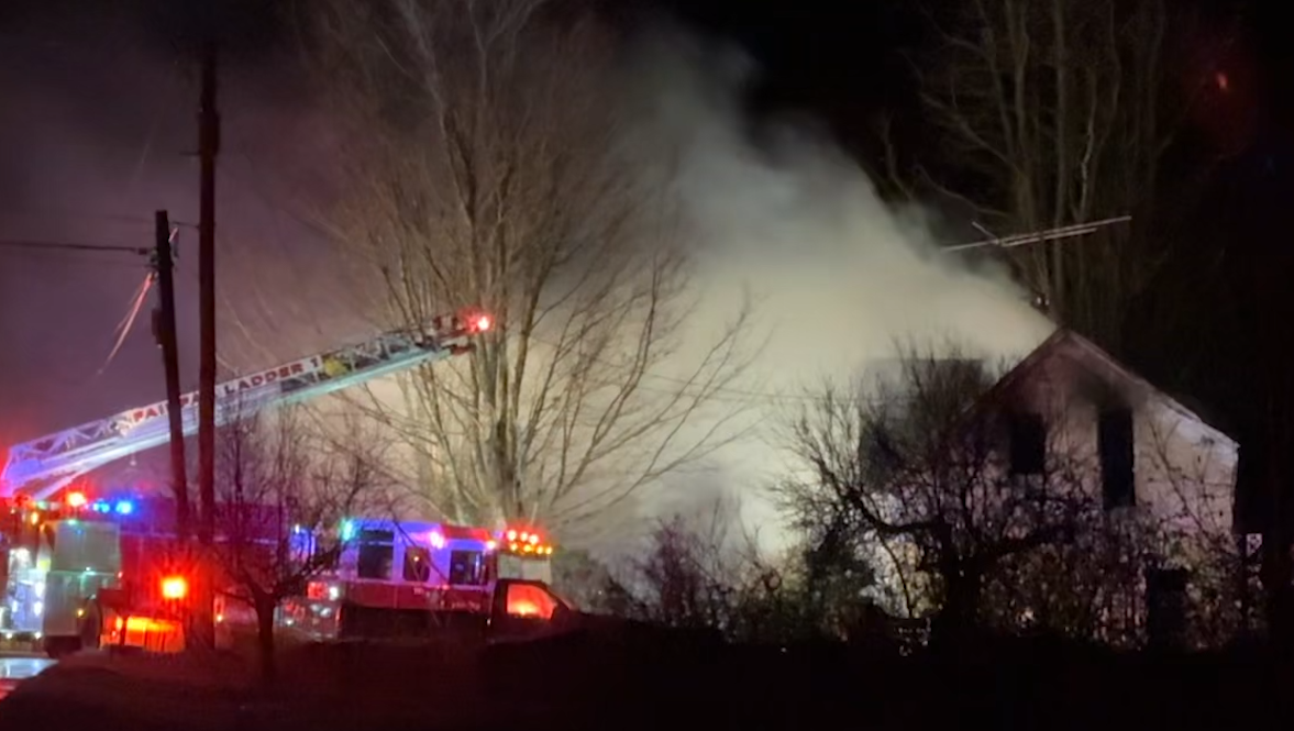 Vermont State Police close road in Fairfax as crews respond to structure fire