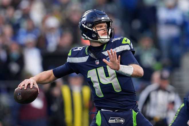 Seattle Seahawks quarterback Sam Darnold throws during the first half of the NFC Championship NFL football game against the Los Angeles Rams, Sunday, Jan. 25, 2026, in Seattle.