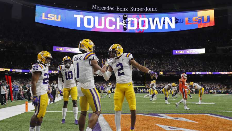 In this Jan. 13, 2020, file photo, LSU wide receiver Ja'Marr Chase (1) celebrates after scoring with wide receiver Justin Jefferson during the first half of a NCAA College Football Playoff national championship game against Clemson in New Orleans.