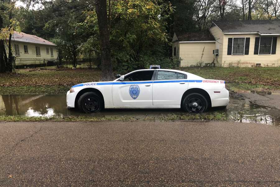 Photos: Jackson police car gets stuck in flooded ditch