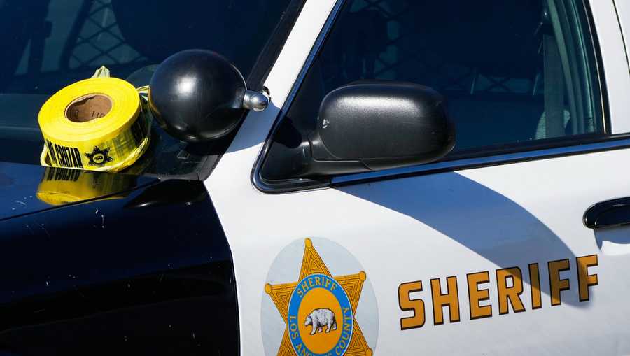FILE - A roll of police tape is left on the windshield of a Los Angeles County sheriff&apos;s vehicle in the parking lot of its training academy.