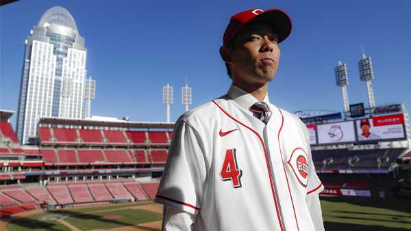Cincinnati Reds outfielder Shogo Akiyama stands for photographs at Great American Ballpark after a news conference, Wednesday, Jan. 8, 2020, in Cincinnati. Outfielder Shogo Akiyama agreed to a $21 million, three-year deal with the Cincinnati Reds, the only major league baseball team that hasn't had a player born in Japan. The 31-year-old center fielder was a five-time All-Star during his nine seasons with the Seibu Lions in Japan's Pacific League. (AP Photo/John Minchillo)