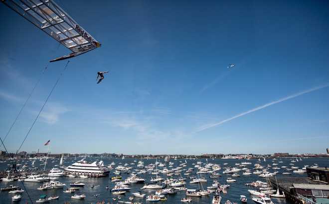 david colturi of the usa dives from the 27.5 metre platform during the& #x20;fifth stop of the red bull cliff diving world series, boston,&#x20 ;usa on august 25th 2013.