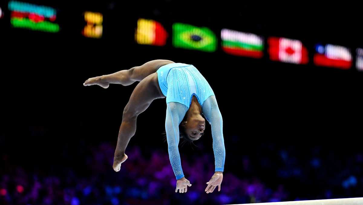 Simone Biles makes history on opening day of qualifying at World ...