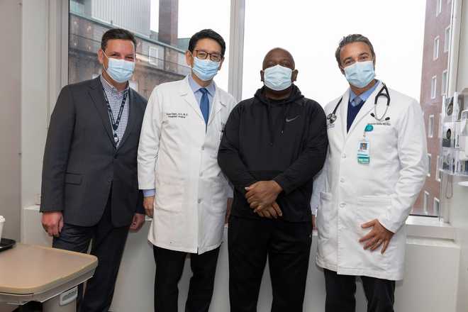 Rick Slayman with his doctors Rick Slayman with his doctors