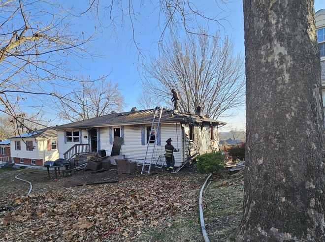 x20; Smalley at the scene of a house fire in the KCFD “5200 Block North”