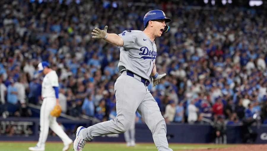 Los Angeles Dodgers&apos; Will Smith celebrates a home run against the Toronto Blue Jays during the11th inning in Game 7 of baseball&apos;s World Series, Sunday, Nov. 2, 2025, in Toronto.