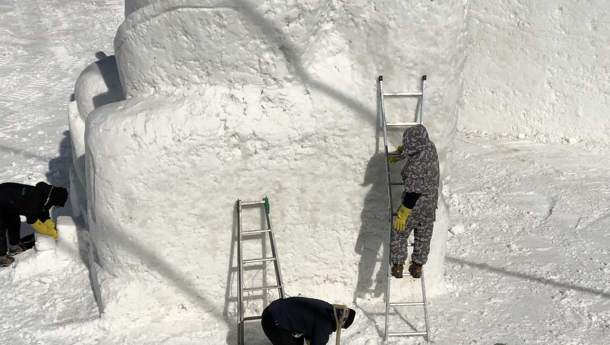 Chainsaw artists create incredible snow sculptures for visitors to the