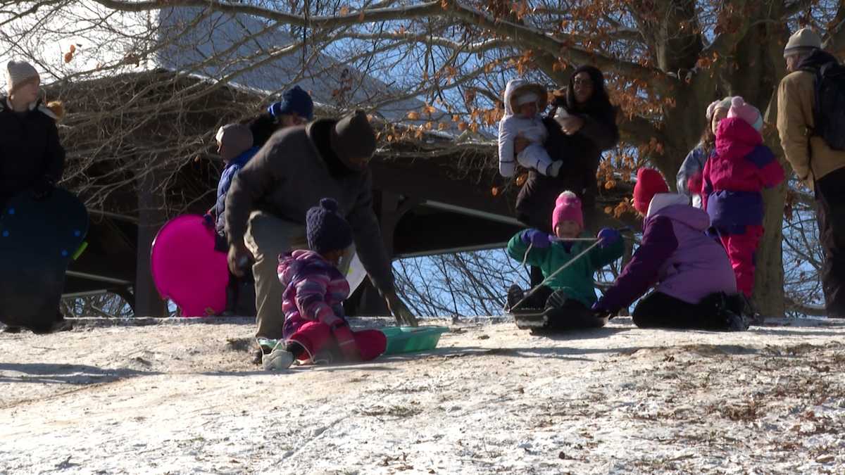 Families enjoy snow day in Louisville with some sledding in the park