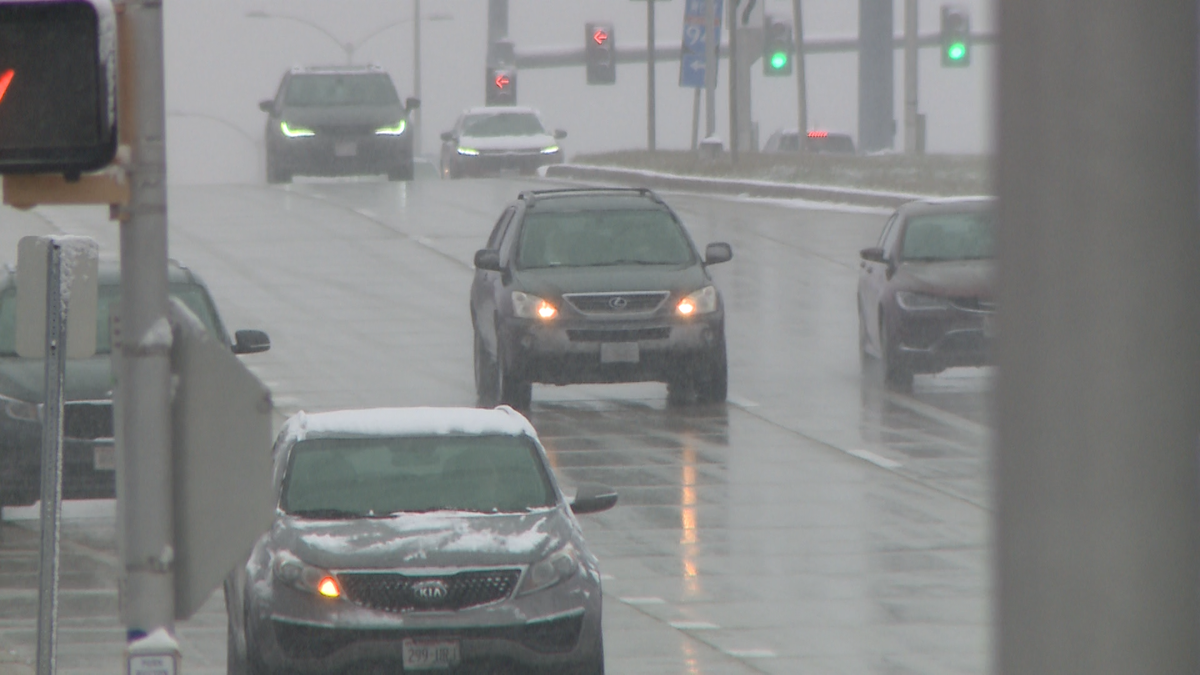 Sunday snow makes for slick roads and runways on busy travel day