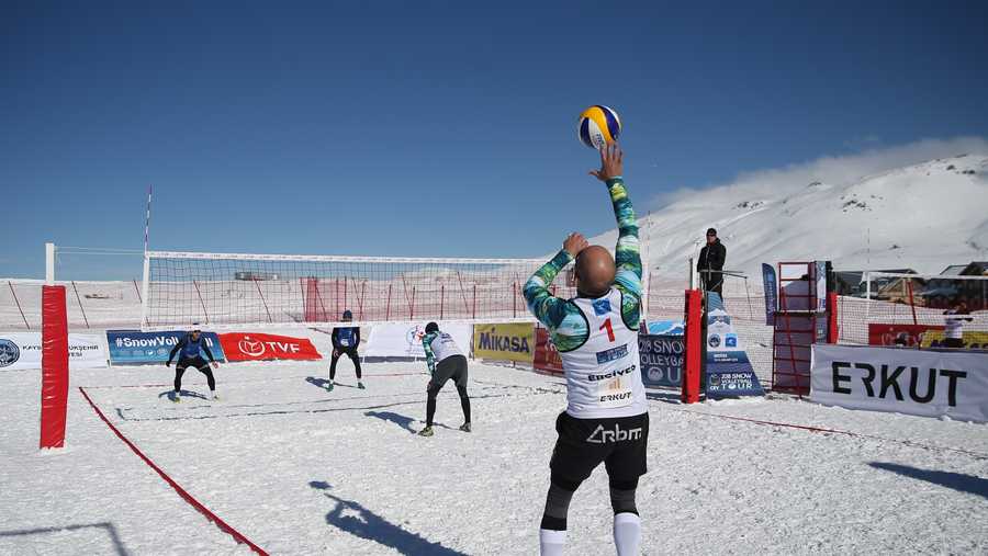 A player serves the ball in a second day match within the European Volleyball Confederation (CEV) Snow Volleyball European Tour at Erciyes Ski Resort in Kayseri, Turkey on January 13, 2018.