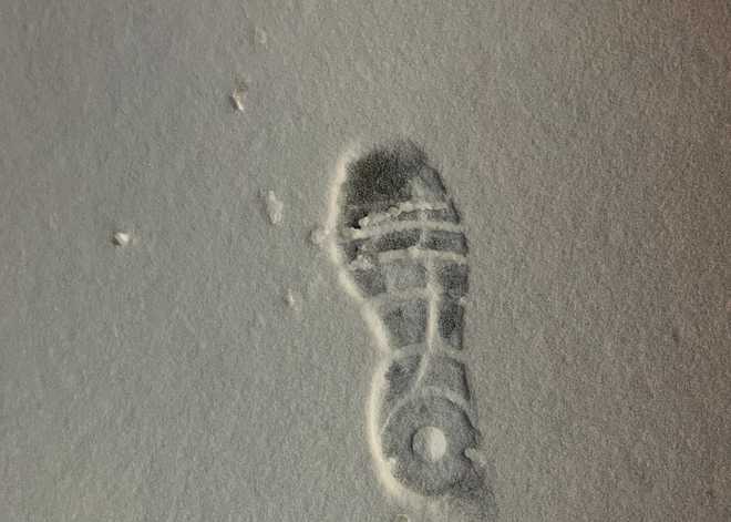 A footprint in the fresh fallen snow is shown. The Lee's Summit Police Department said a burglary suspect left this trail of footprints behind after allegedly breaking into a business and stealing vapes.