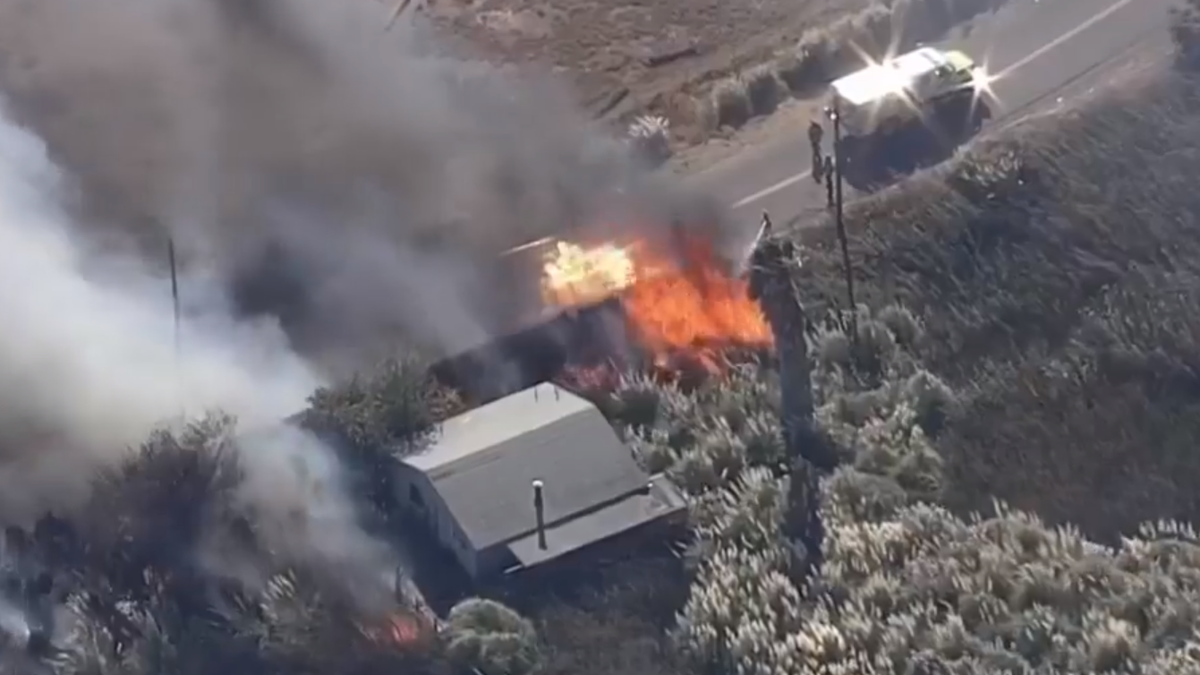 Crews battle grass fire