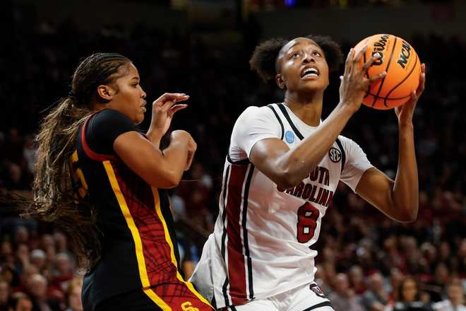 South Carolina forward Joyce Edwards (8) looks to shoot against Southern California guard Kara Dunn during the first half in the second round of the NCAA college basketball tournament, Monday, March 23, 2026, in Columbia, S.C.