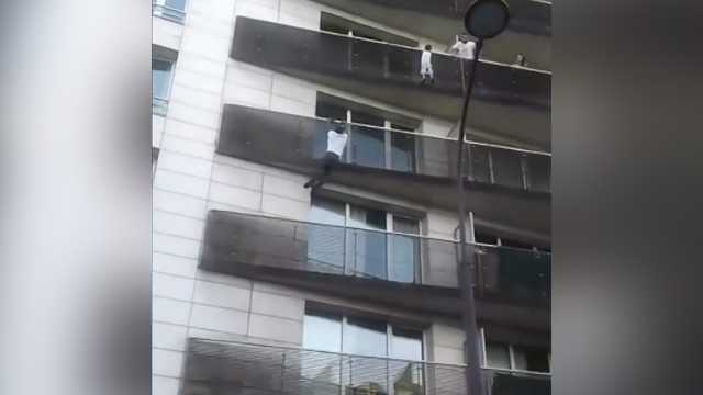 Incredible video: 'Spiderman' scales building, rescues child dangling ...