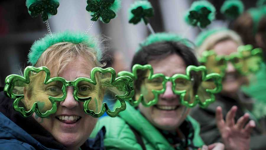 FILE - This file photo from Saturday March 16, 2019, shows Sharon Keely, left, of Dublin, viewing the St. Patrick's Day Parade along Fifth Avenue in New York.