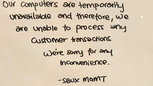 Some Starbucks across North America put signs up similar to this after their computer system went down on Tuesday. This sign was on a Starbucks in  California.