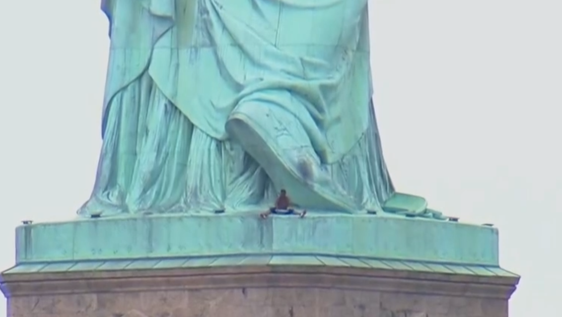New York police capture woman who climbed on bottom of Statue of Liberty