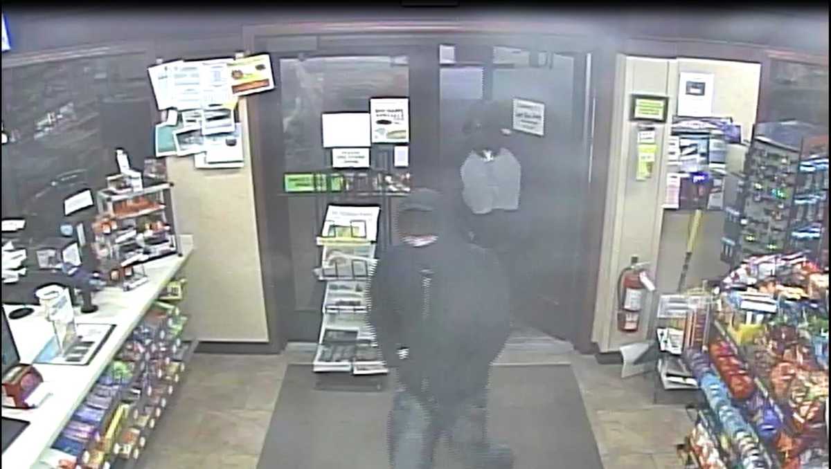 Police search for 2 in gas station robbery