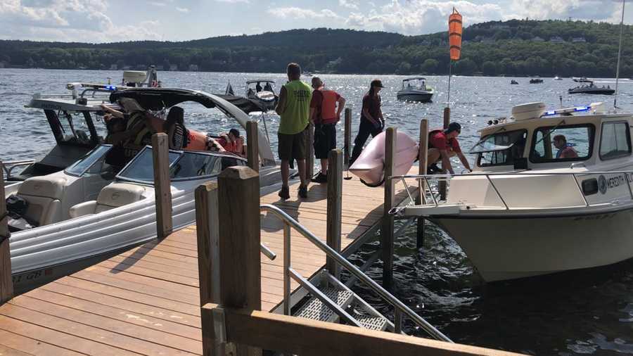 First responders met Stoneham Police Officer Joe Ponzo at a dock to help transport a pilot who crashed into Lake Winnipesaukee on Aug. 9, 2020.