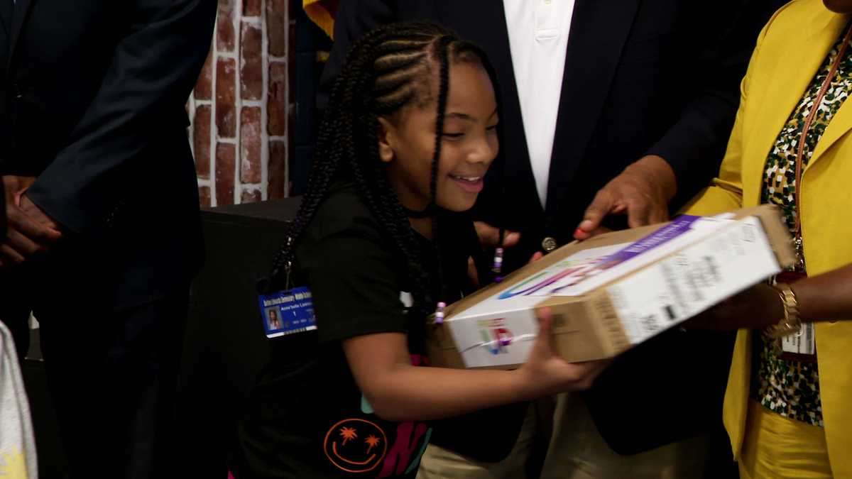 Broadband internet expansion celebrated with free laptops for students