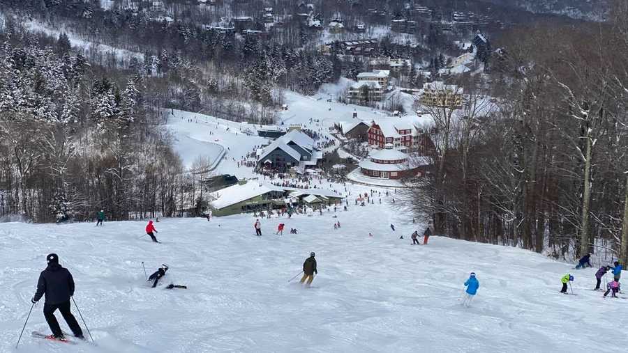 A photo showing skiers and snowboarders heading down a trail at Sugarbush Resort in Warren, Vermont.