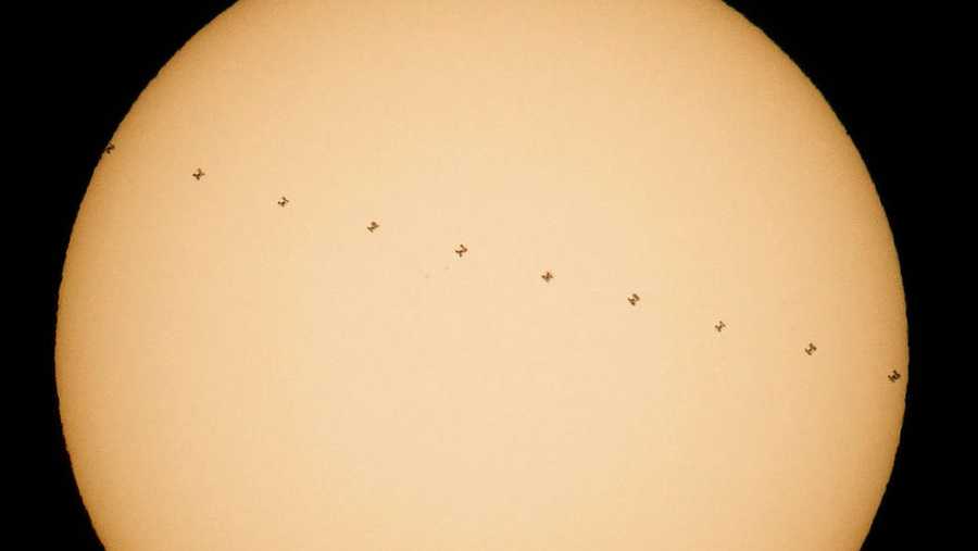 The International Space Station passes the sun.