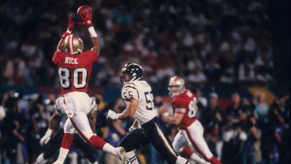 MIAMI, FL - JANUARY 29:  Wide receiver Jerry Rice #80 of the San Francisco 49ers catches a pass behind linebacker Junior Seau #55 of the San Diego Chargers in Super Bowl XXIX at Joe Robbie Stadium on January 29, 1995 in Miami, Florida. The 49ers defeated the Chargers 49-26. (Photo by Joseph Patronite /Getty Images)