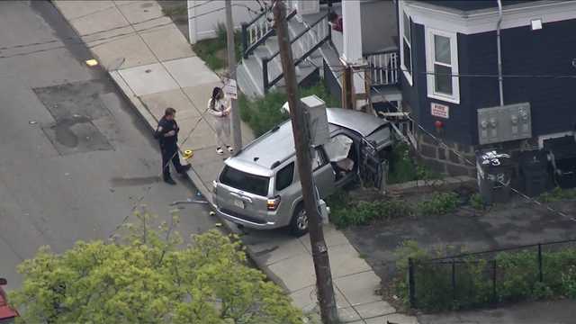Man shot while driving, crashes SUV into Boston home, source says - Vimarsana News