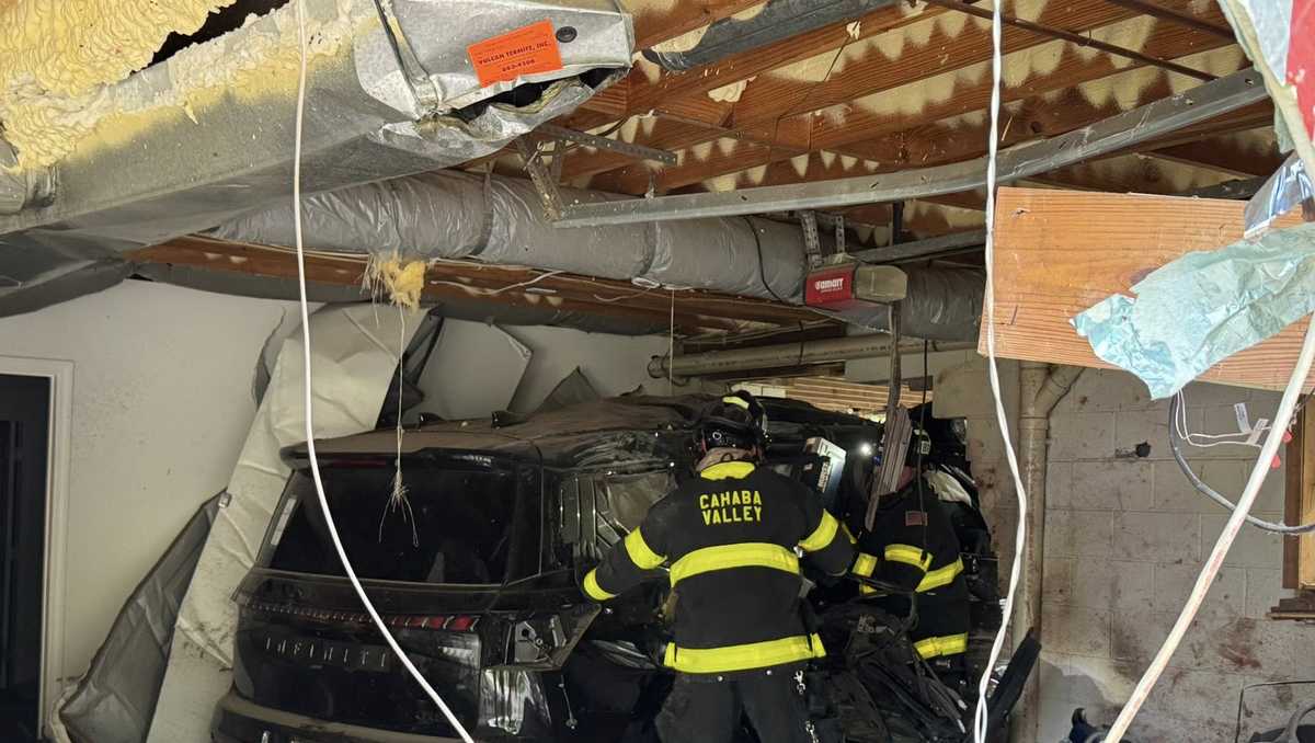 Woman rescued after SUV crashes into Birmingham home, causes gas leak