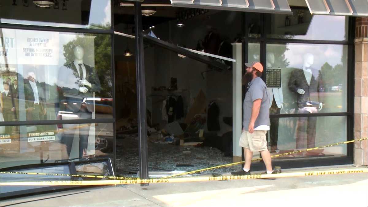 SUV crashes through front of tuxedo shop