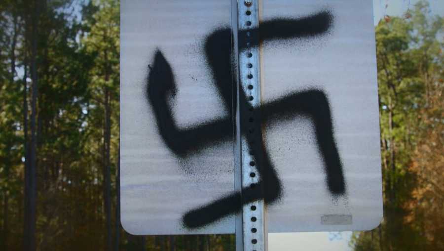 Road signs defaced with Nazi symbols, acronyms Road signs defaced with Nazi symbols, acronyms