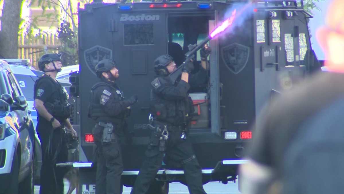 2 officers released, 1 remains hospitalized after standoff shooting