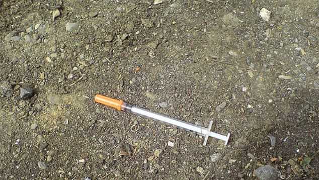 File: Syringe on ground 