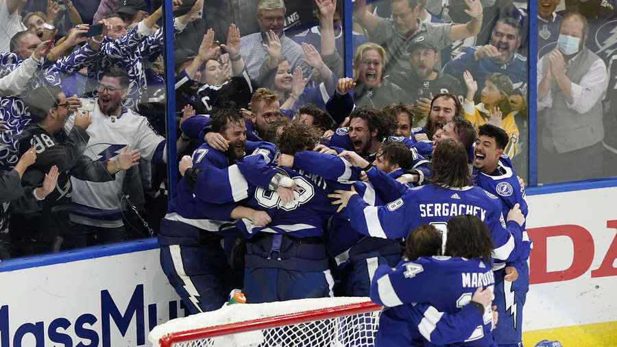 The Tampa Bay Lightning celebrate their series win over the Montreal Canadiens to clinch the Stanley Cup in Game 5 of the NHL hockey finals, Wednesday, July 7, 2021, in Tampa, Fla.