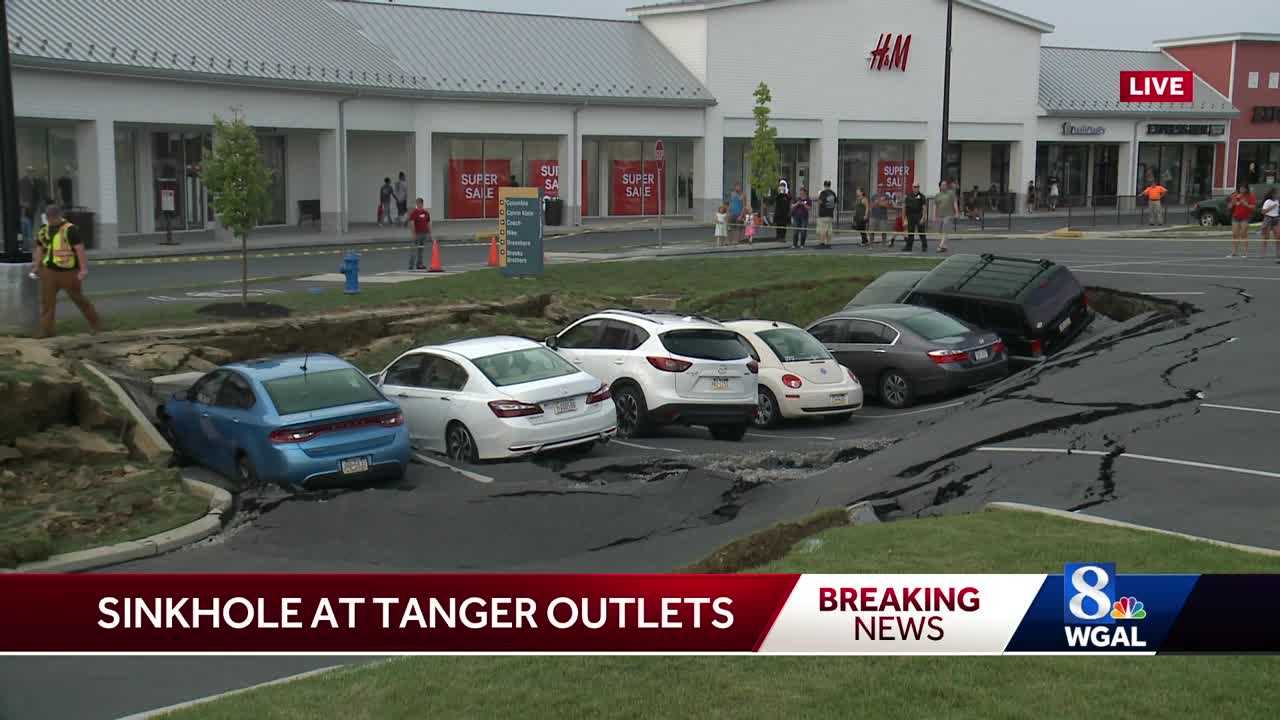 Work to fix Tanger Outlet sinkhole delayed, cause still under investigation